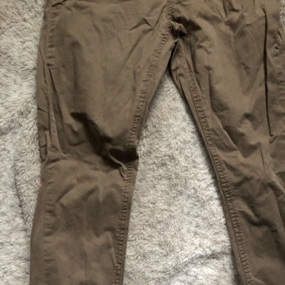 Light green jeans with minor bleach stains